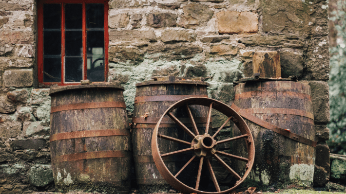 several wooden barrels outside a cottage at the ulster american folk park 