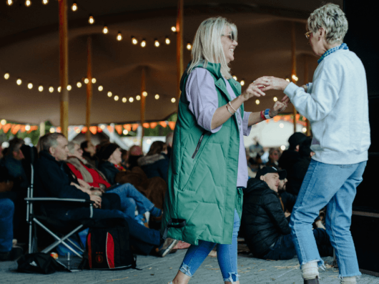 two women dancing at bluegrass omagh 2022